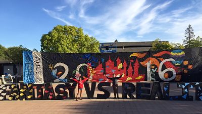 HHS students, Alyssa Hiroaka (12) and Cyrus Miremadi (12) pose next to Homecoming decorations on LHS’s campus.