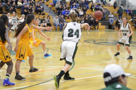Junior Ciara Barros passes the ball to sophomore Lindsey Takahashi on the way to a 55-28 win over Milpitas High School