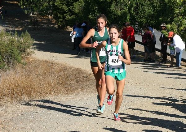 Kamas running in one of her cross country competitions. 
Photo by Elena Kamas.