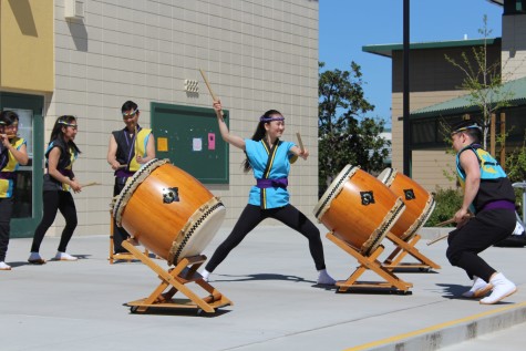 Hana Mizuta (12) plays the taiko drum during the performance at lunch.