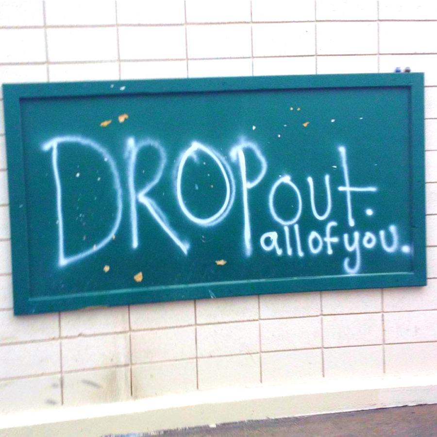 The words “DROP OUT. ALL OF YOU.” appeared in white spray paint on  the F Building school bulletin board on Thursday 
