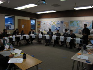 Model United Nations club president Lucas Bandarkar, far left, presents as William Ormsby-Gore to the 1937 U.K. Executive Cabinet committee.