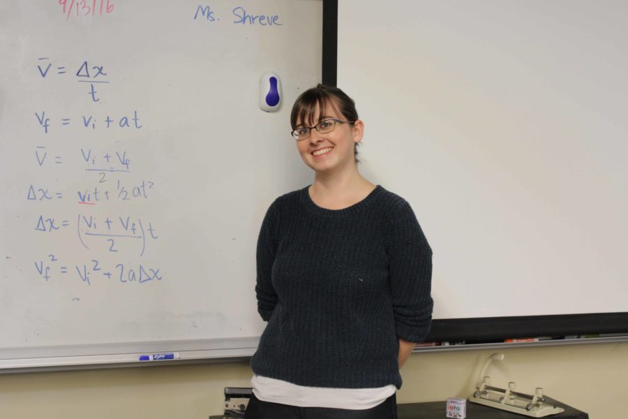 Ms Shreve in front of her handwritten kinematic equations