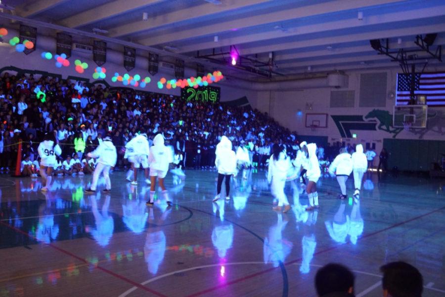 Krew performing their upbeat dance in all white.