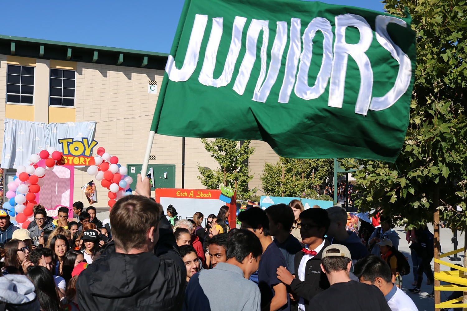 The juniors crowd into their area for cheer-offs.