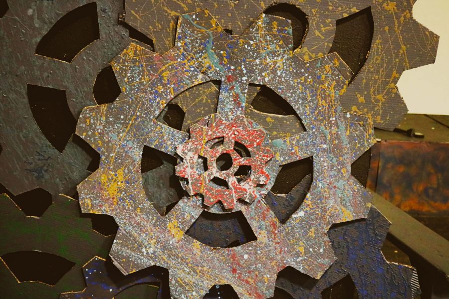 Steampunk cogs covered in paint splatters