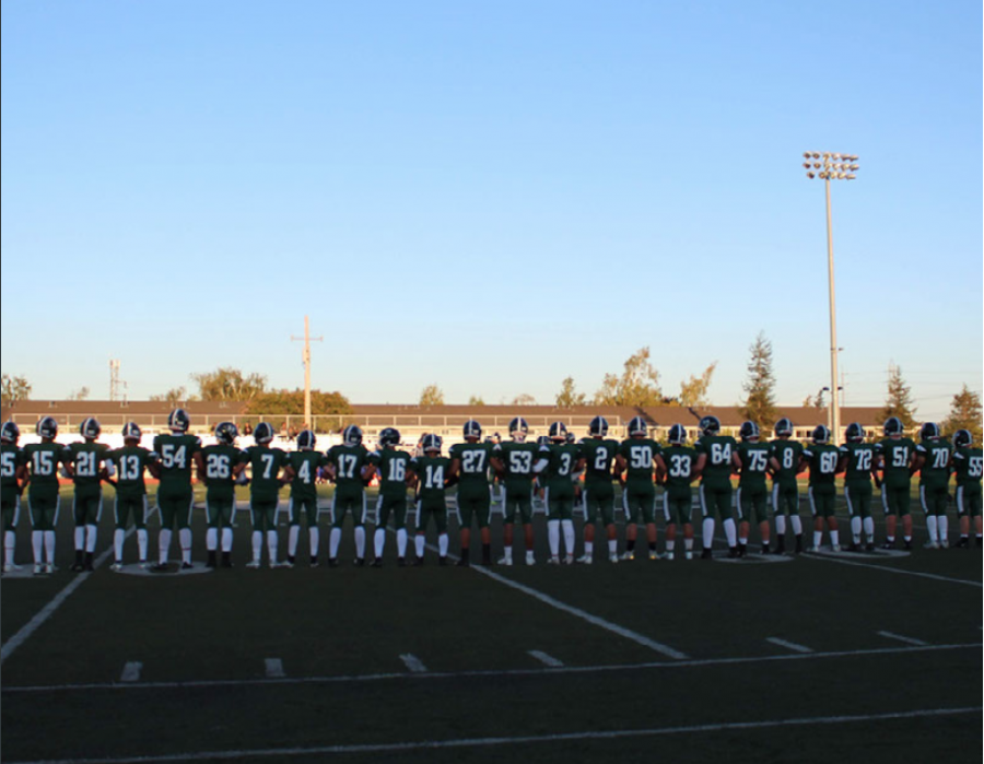 The varsity football team lines up at the start of their Sept. 6 game against South San Francisco High School, in which they defeated the Warriors 68-6.