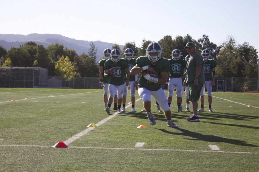 The team prepares for the homecoming game by running drills in practice throughout the week.