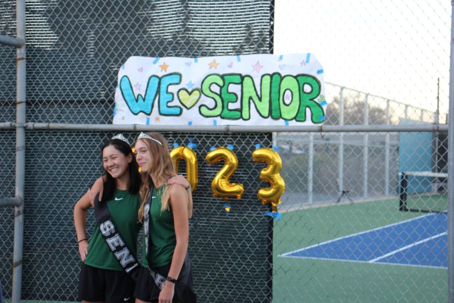 Varsity tennis players, seniors Ivy Zhan and Coline Gingembre are honored for their years with the program during senior night after the game. 