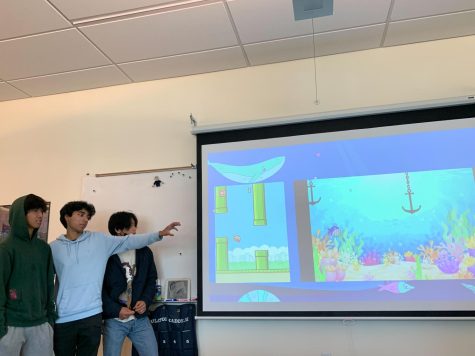 Students present their programming projects to the rest of the club. Flappy Fish is one of the projects. It is a remake of the classic Flappy Bird game. 