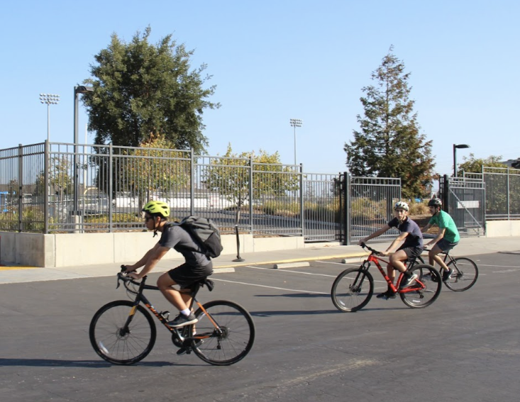 Mr. Grossman bikes alongside the students.