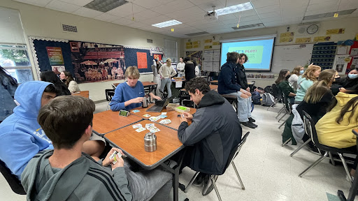 Students have fun learning and playing traditional French board games.
