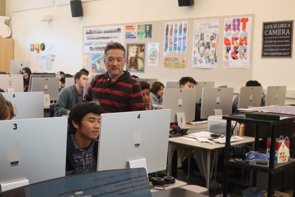 Digital art teacher Edmond Kwong said he prioritizes connecting with students through sharing personal stories. 
