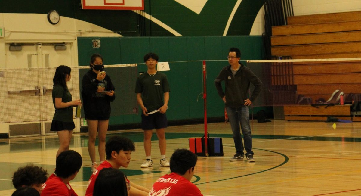 Aside from aiming to win, new badminton coach Jack Ip (right) said he hopes to instill a love for the sport in players.